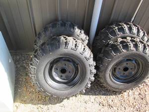 lot 29 image: Set of New 4 bolt skid loader tires...