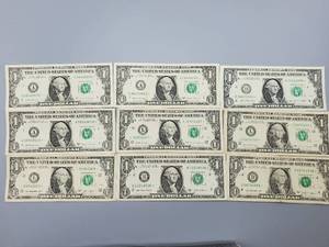 lot 67 image: 9 $1 U.S. Star Federal Reserve Notes
