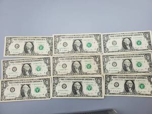 lot 73 image: 9 $1 U.S. Star Federal Reserve Notes