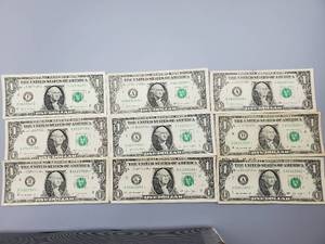 lot 74 image: 9 $1 U.S. Star Federal Reserve Notes