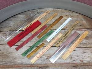 lot 115 image: Group Vintage Advertiser Rulers