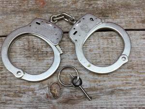 lot 177 image: Smith & Wesson Handcuffs - with Key