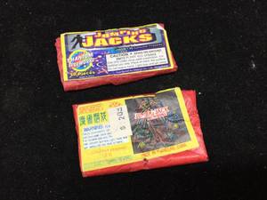 lot 292 image: 2 Pucks Vintage Jumping Jacks - Labels