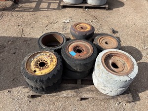 lot 59 image: Pallet of (11) Industrial tires and rims, likely for heavy yard equipment