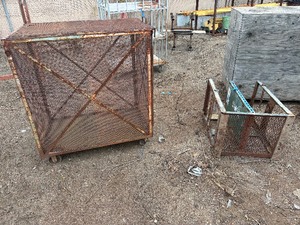 lot 70 image: Steel mesh security cage on casters for easy mobility and forklift attachment rack