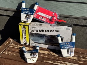 lot 74 image: G - Pistol-Grip Grease Gun, Sawzall Blade, and Tool Hangers Lot