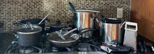 lot 82 image: K - Assorted Cookware Set with Fry Pans, Stock Pots, Utensils, and Grater