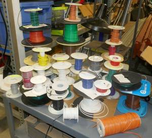 lot 12 image: Box with spools of various size wire and various amounts on them