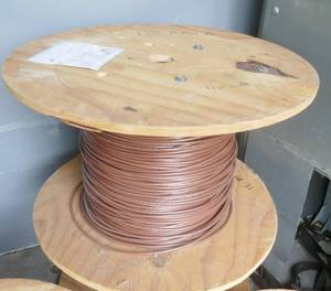 lot 15 image: Roll of Anixter 6W-1219-07  12AWG 600V stranded PVC insulated wire, originally 1000 ft Brown