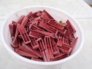 lot 14 image: 4.5 Gallons of Tile Wedges