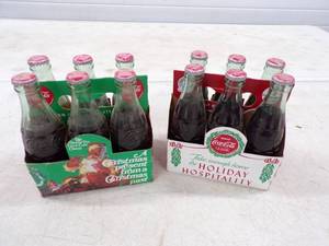 lot 22 image: 12 Vintage Coke Bottles with Christmas Cases