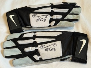 lot 120 image: TJ Clemmings Signed and Used NFL Gloves Minnesota Vikings Football