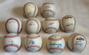 lot 122 image: (10) Minnesota Twins Signed Baseballs - Diaz, Santiago, Holt, Morin, Centeno, Gibson, Nuno, Venditte, Gimenezes, Wally The Beer Man