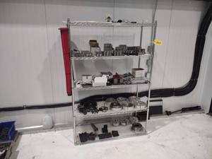 lot 563 image: NSF Wire Rack with Lathe Chuck Jaws...
