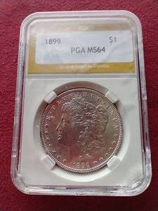 lot 103 image: 1899 Morgan Dollar PGA MS64 - Tough Date