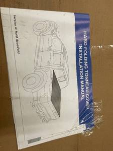 lot 14 image: Hard Folding Tonneau Cover for Pickup Truck with Installation Manual