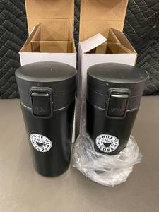 lot 53 image: Set of 2 Nice Cups Black Travel Mugs with Boxes