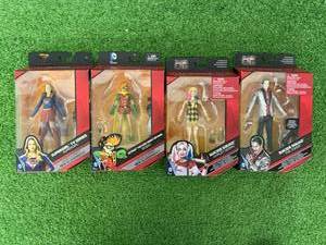 lot 143 image: DC Multiverse Supergirl, Robin, Harley Quinn & The Joker