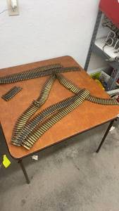 lot 846 image: Linked Belt of Spent Brass Rifle Casings