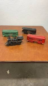 lot 848 image: Set of 4 Vintage Cast Iron Toy Train Cars Including Locomotive and Passenger Cars