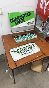 lot 878 image: Set of 3 Interstate Batteries Metal Advertising Signs with Wire Stands