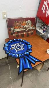 lot 884 image: Famous Daves BBQ Metal Sign and Worlds Greatest Ribs Ribbon Display