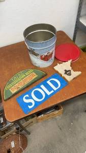 lot 912 image: Holiday Popcorn Tin, SOLD Sign, Wood Opener, and Vintage Medal Half Plaque