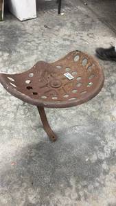 lot 1856 image: Vintage Cast Iron Tractor Seat with Mounting Bracket
