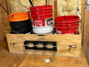 lot 1322 image: Ice Fishing Gear Lot with Rods, Buckets, Lures, and Accessories
