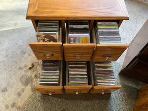 lot 1353 image: Oak Media Cabinet with 6 Drawers and Assorted Music CDs