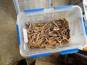lot 1365 image: Large Bin of Vintage Wooden Clothespins and Assorted Shelf Brackets
