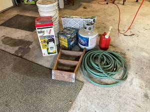 lot 1369 image: Garage Lot Including Garden Hose, Propane Tank, Storage Buckets, Air Filters, Gas Can, and Wagner Stainer