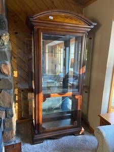 lot 1375 image: Wood and Glass Curio Cabinet with lighting and intricate carving details
