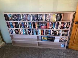 lot 1377 image: Large Collection of DVDs, VHS Tapes, and Box Sets with Bookshelf