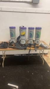 lot 250 image: Set of 4 ProTeam Super Coach Backpack Vacuums with Harnesses