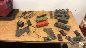 lot 296 image: Vintage Lionel Train Set with Engines, Cars, Track Sections, and Transformers