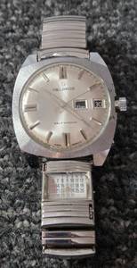 lot 29 image: Vintage Helbros Mens Watch West German movement. Self Winding. Includes calendar on band.  Stainless steel.