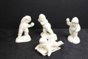 lot 19 image: Set of 4 Antique Bisque Snow Baby Figurines