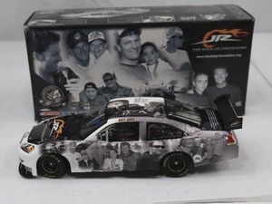 lot 63 image: Dale Jr Foundation Die-Cast Car with Box and Documentation