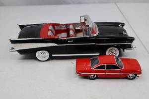 lot 297 image: Jada 132 Red Diecast Car and Black Chevy Bel Air Convertible Model Lot