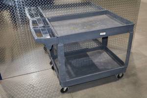 lot 312 image: Heavy-duty plastic utility cart with two shelves and compartments