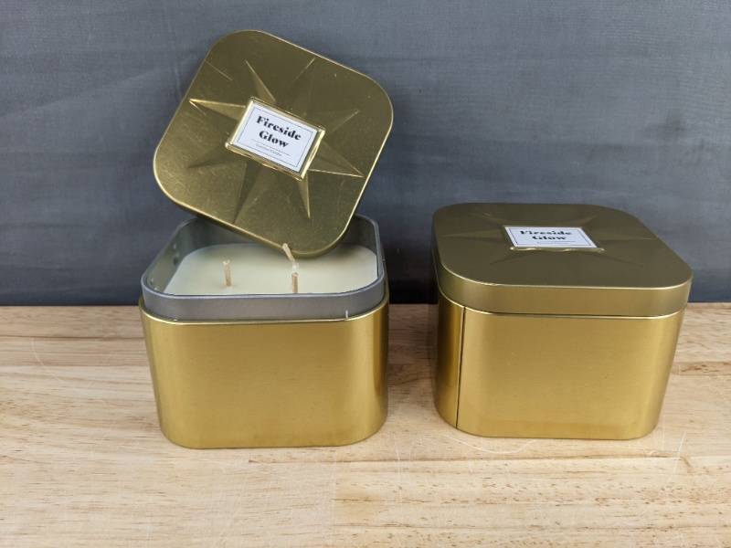 lot 96 image: 2 Brand New Fireside Glow 3-Wick Scented Candles in Gold Tin