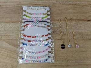 lot 153 image: Taylor Swift Friendship 12 Beaded Bracelets and 3 Charm Bracelets - Brand New