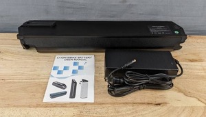 lot 95L image: 48V 14Ah Lithium-Ion E-Bike Battery with Charger and Manual - Brand New A