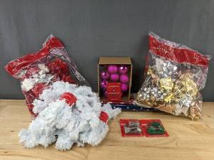 lot 332 image: 3 Rolls Wrapping Paper, 80 Bows, 6 Garland, 20 Wondershop Ornaments & More - Brand New
