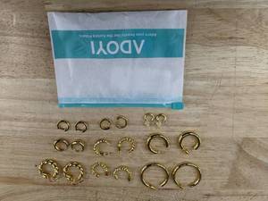 lot 385 image: 9 Pairs Aurora Pierced Gold Tone Hoop Earrings