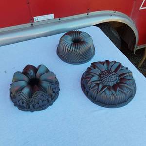 lot 52 image: Nordic Ware Sunflower Pan Baking Mold and 2 Other Nordic Ware Baking Mold Pans