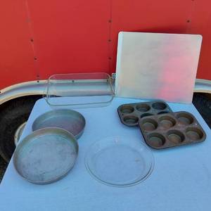lot 54 image: Kitchen Bakeware  including 9-inch Pie Pan, Glass Baking Dish, Muffin Tins, and Sheet Pan