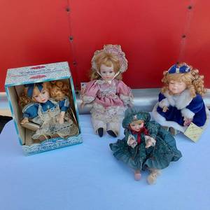 lot 120 image: Lot of 4 Porcelain Dolls - 2 Musical