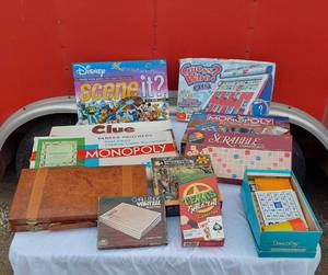 lot 128 image: Board Games and Puzzles Clue, Monopoly, Disney Scene It, Scrabble